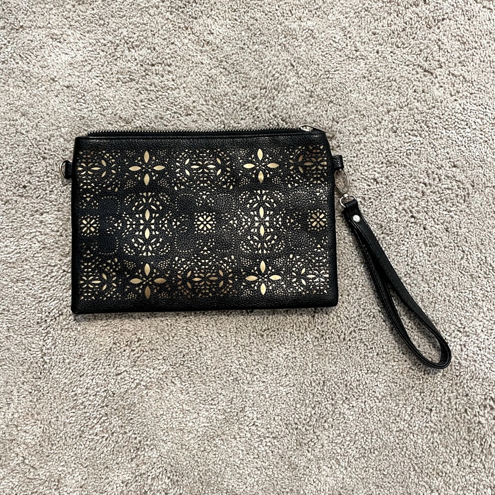 Clutch size purse with wristlet strap.